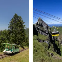 Le funiculaire du Puy de Sancy monte à travers les montagnes verdoyantes. Une cabine jaune transporte des passagers vers le sommet.